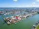 Aerial view of waterfront home with private dock and beautiful landscaping at 12520 4Th E St, Treasure Island, FL 33706