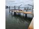 Waterfront dock with lift and multiple boat slips at 12520 4Th E St, Treasure Island, FL 33706