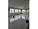 Bright living room with tiled floors and large windows overlooking the water at 12520 4Th E St, Treasure Island, FL 33706