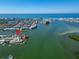 An aerial view shows a waterfront home and its surroundings at 12520 4Th E St, Treasure Island, FL 33706