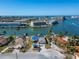 Waterfront property showcasing a home with solar panels at 12520 4Th E St, Treasure Island, FL 33706