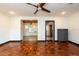 Spacious living room featuring hardwood floors and a large bay window at 1311 E Park Cir, Tampa, FL 33604