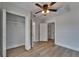 Bedroom with wood-look floors and an open closet at 1312 E Louise Ave, Tampa, FL 33603
