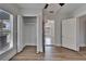 Well-lit bedroom features closet and wood-look flooring at 1312 E Louise Ave, Tampa, FL 33603