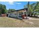 Exterior of a charming house with wood siding and a cozy front porch at 1312 E Louise Ave, Tampa, FL 33603