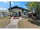 Charming single-story home with covered porch and craftsman-style details on a sunny day at 1312 E Louise Ave, Tampa, FL 33603