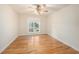 Bedroom with hardwood floors, neutral walls and natural light through a window at 13811 Shady Shores Dr, Tampa, FL 33613