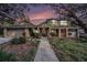 Two story house with landscaping and walkway at dusk at 13811 Shady Shores Dr, Tampa, FL 33613