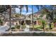 Charming home with manicured landscaping, brick accents, and a welcoming front entrance at 13811 Shady Shores Dr, Tampa, FL 33613