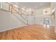 Grand foyer features hardwood floors, staircase, and decorative glass front doors at 13811 Shady Shores Dr, Tampa, FL 33613