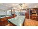 Kitchen with a center island, granite counters and adjacent eat-in space at 13811 Shady Shores Dr, Tampa, FL 33613
