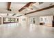 Bright living room with high ceilings, exposed beams, and tile floors at 13811 Shady Shores Dr, Tampa, FL 33613