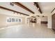 Expansive living room boasts beamed ceilings and leads to an open kitchen and dining area at 13811 Shady Shores Dr, Tampa, FL 33613