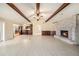 An expansive living room connects seamlessly with a kitchen and a cozy fireplace area at 13811 Shady Shores Dr, Tampa, FL 33613