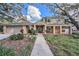 Two story house with landscaping and walkway at 13811 Shady Shores Dr, Tampa, FL 33613