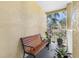 Balcony with a wooden bench and potted plants at 1408 Millstream Ln # 206, Dunedin, FL 34698