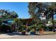 Outdoor seating area of a restaurant with umbrellas and plants at 2125 1St N Ave, St Petersburg, FL 33701