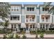 Three-story townhomes with light teal siding and balconies at 2125 1St N Ave, St Petersburg, FL 33701