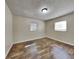 Simple bedroom with wood-look flooring at 315 Lime Tree Rd, Tampa, FL 33619