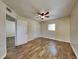 Main bedroom with ceiling fan and double closet at 315 Lime Tree Rd, Tampa, FL 33619