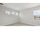 Comfortable bedroom with three windows and neutral carpet at 35298 Big Hawk Dr, Zephyrhills, FL 33541