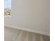Bedroom with carpet flooring, a window overlooking the outside, and neutral colored walls at 35298 Big Hawk Dr, Zephyrhills, FL 33541