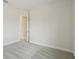 Bedroom with carpet flooring, neutral colored walls, and an open doorway at 35298 Big Hawk Dr, Zephyrhills, FL 33541