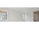 Bedroom with gray carpeting and multiple windows at 35298 Big Hawk Dr, Zephyrhills, FL 33541