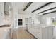 Contemporary kitchen featuring quartz countertops, stainless steel appliances, gas cooktop and white cabinetry at 35298 Big Hawk Dr, Zephyrhills, FL 33541