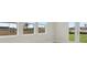 Living room with backyard view through the windows and glass patio doors at 35298 Big Hawk Dr, Zephyrhills, FL 33541