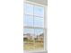 Close up of the window and the neighborhood behind it at 35298 Big Hawk Dr, Zephyrhills, FL 33541