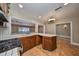 Kitchen with tile countertops and pass-through to dining area at 6657 Bougainvilla S Ave, St Petersburg, FL 33707