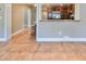 Kitchen with wooden cabinets and a breakfast bar at 6657 Bougainvilla S Ave, St Petersburg, FL 33707