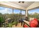 Screened balcony with outdoor furniture and treetop views at 700 Starkey Rd # 352, Largo, FL 33771