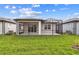 Expansive backyard featuring a screened-in lanai, perfect for outdoor entertaining at 9434 Shorebird Ct, Parrish, FL 34219