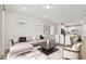 Bright living room showcases an open floor plan with stylish furnishings and lots of natural light at 9434 Shorebird Ct, Parrish, FL 34219