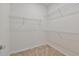 A walk-in closet provides ample storage space with multiple wire shelves for organization at 9434 Shorebird Ct, Parrish, FL 34219