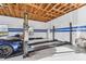 Garage with car lift and overhead storage at 10930 Earhart Dr, New Port Richey, FL 34654