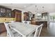 Kitchen dining area with a farmhouse table and chairs at 10930 Earhart Dr, New Port Richey, FL 34654