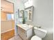 Bathroom featuring a vanity with a mirror and a toilet at 1163 Orange Tree W Cir # C, Palm Harbor, FL 34684