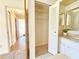 En suite bathroom features double mirrors and a convenient storage closet at 1163 Orange Tree W Cir # C, Palm Harbor, FL 34684