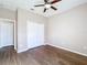 Bright bedroom with wood-look floors and ceiling fan at 12403 Ballentrae Forest Dr, Riverview, FL 33579