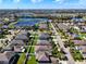 An aerial view of a residential neighborhood with a lake at 12403 Ballentrae Forest Dr, Riverview, FL 33579