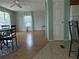 Bright dining area with laminate floors and a view into the living room at 12501 Ulmerton Rd # 119, Largo, FL 33774