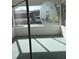 Cozy screened porch with a lighthouse-themed design at 12501 Ulmerton Rd # 119, Largo, FL 33774