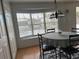 Dining room with bay window and wood-look flooring at 12501 Ulmerton Rd # 119, Largo, FL 33774