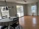 Spacious living room with laminate flooring and access to the screened porch at 12501 Ulmerton Rd # 119, Largo, FL 33774