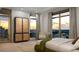 Serene bedroom with expansive city views, stylish wardrobe, and comfortable seating area at 126 4Th Ne Ave # 1302, St Petersburg, FL 33701