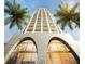 Unique high rise building with arched entry, numerous balconies and palm trees in view at 126 4Th Ne Ave # 1302, St Petersburg, FL 33701