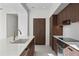 Bright kitchen showcasing stylish wooden cabinets, modern appliances, and a large island with a sink at 126 4Th Ne Ave # 1302, St Petersburg, FL 33701